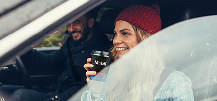 Woman enjoying a Mobil coffee 